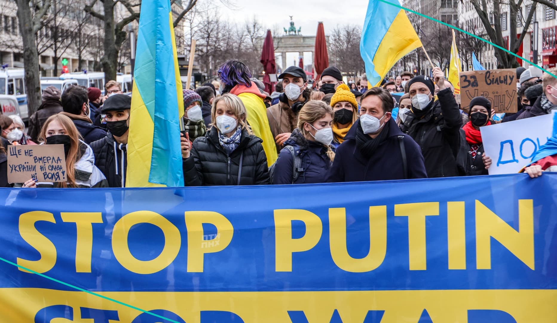 Protesters hold a "Stop Putin" banner in Germany