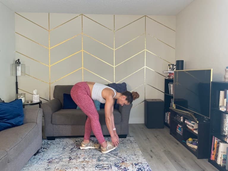 Personal trainer demonstrating waterfall calf stretch