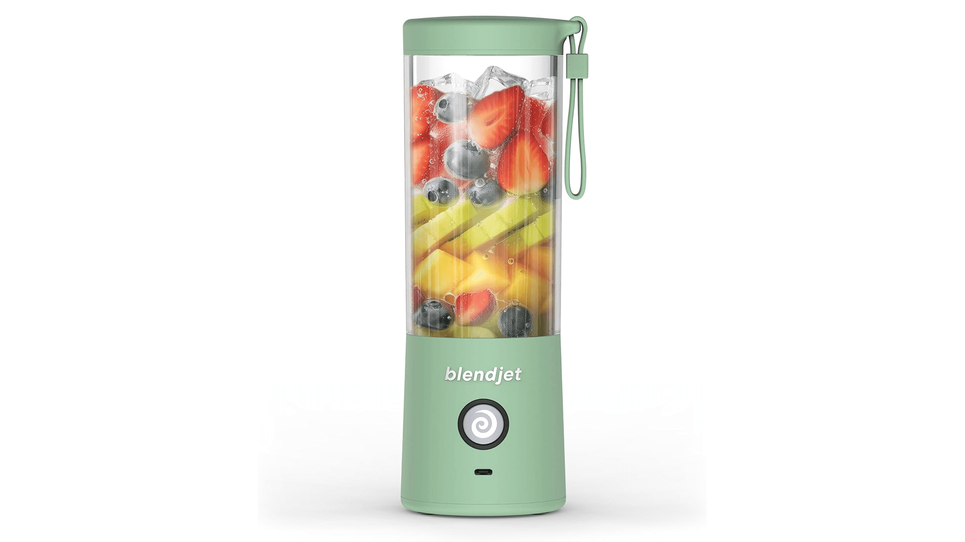 Portable blender in sage green with fruit inside