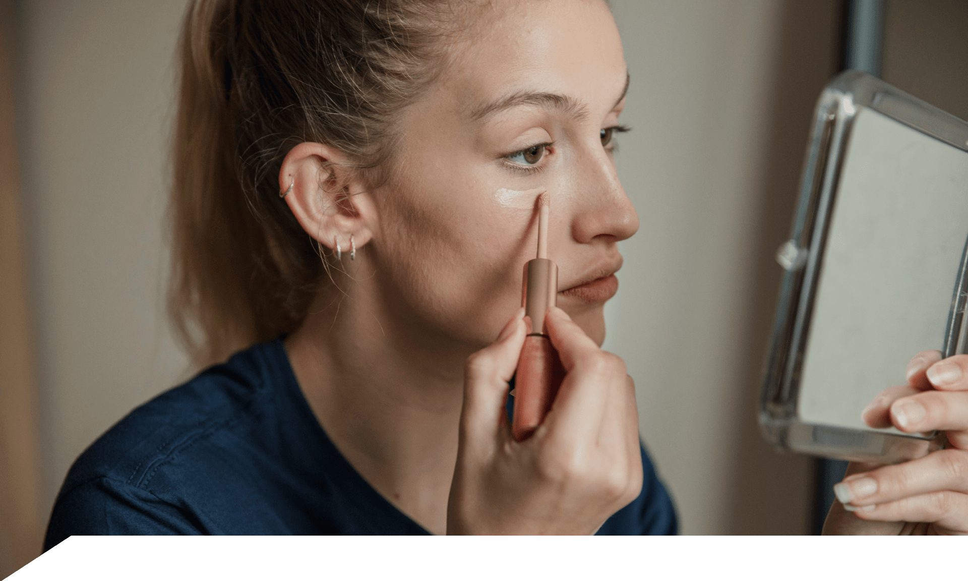 Woman putting on makeup