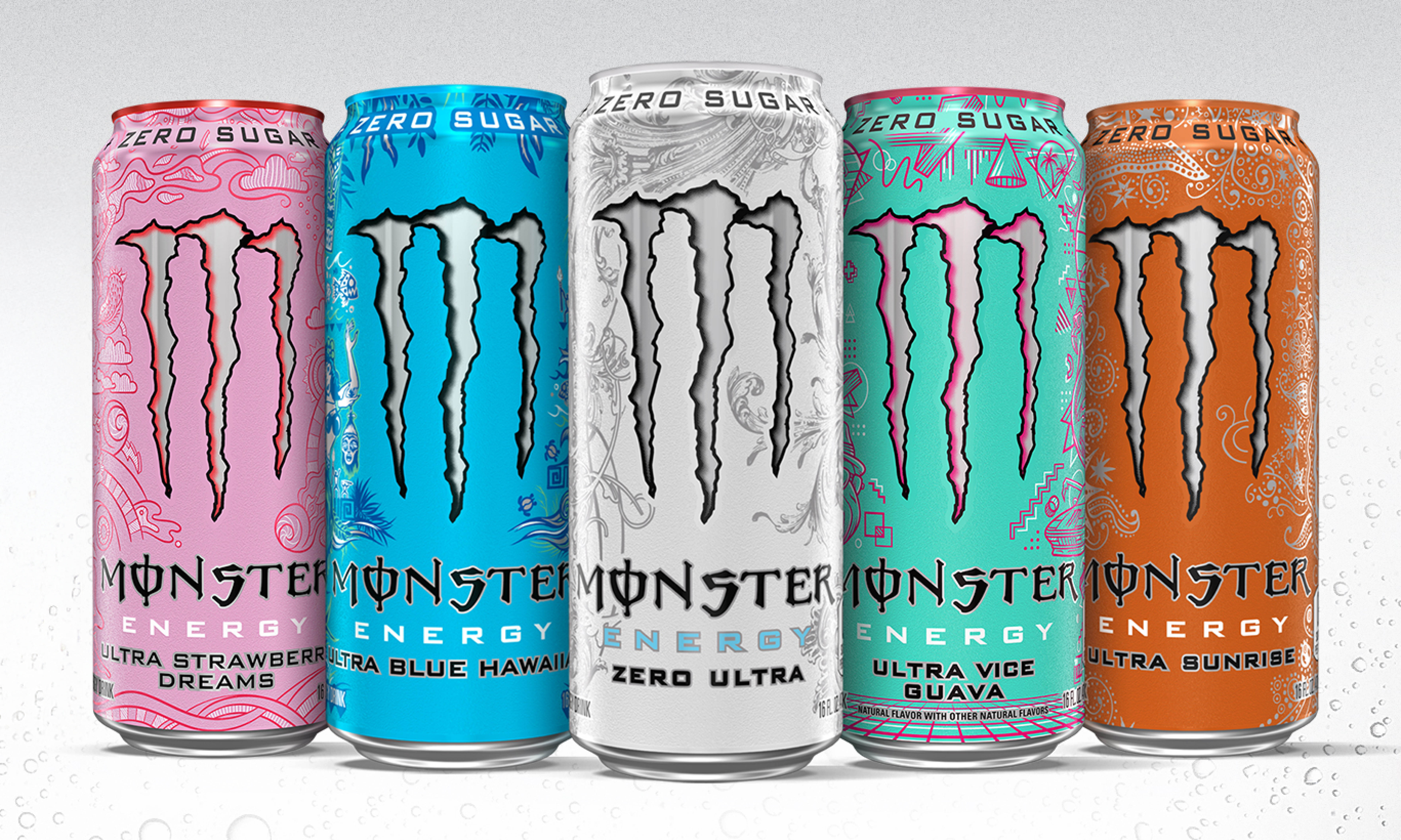 three monster energy drinks