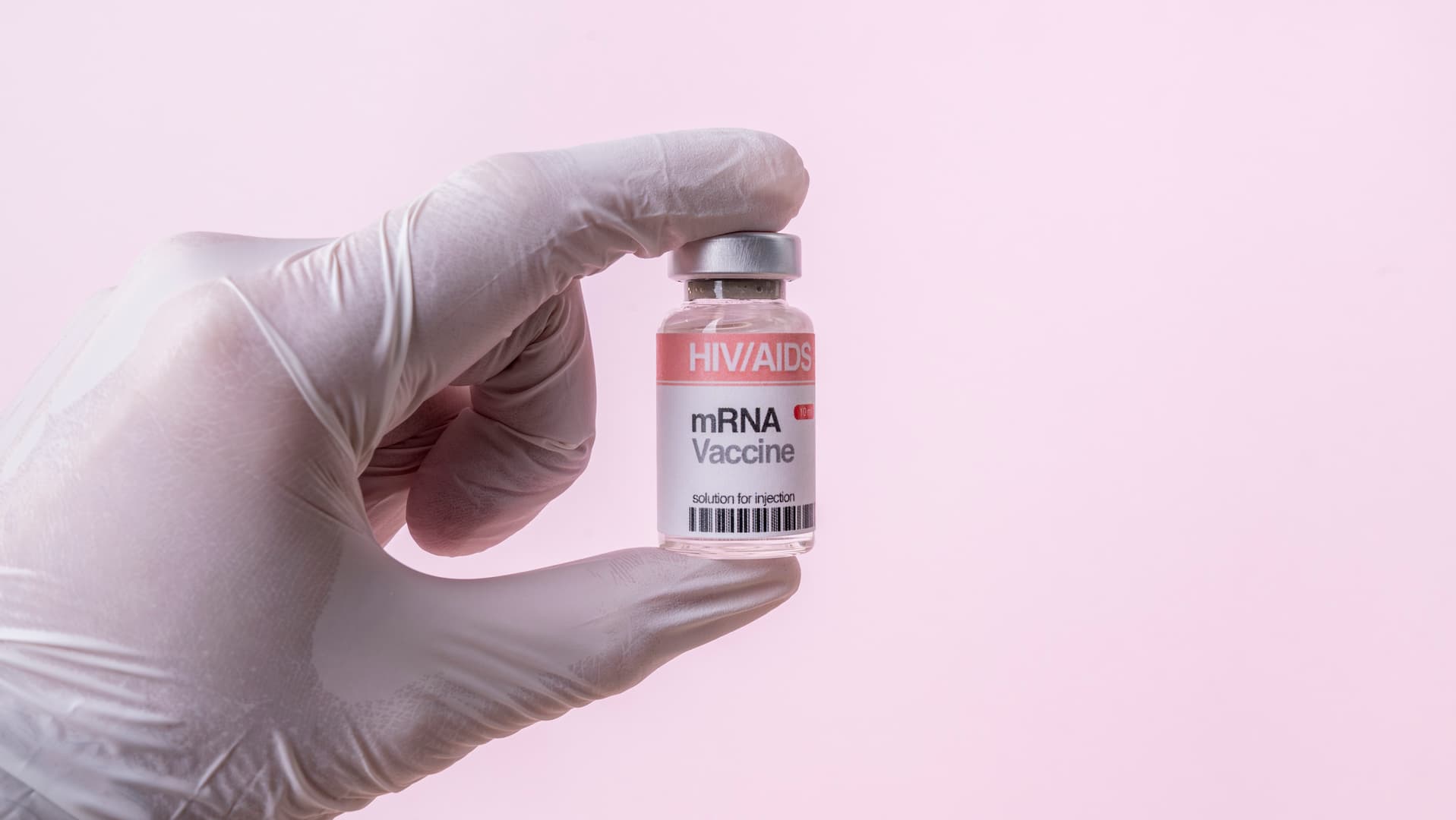 Health worker holding an mRNA vaccine multidose vial for HIV.