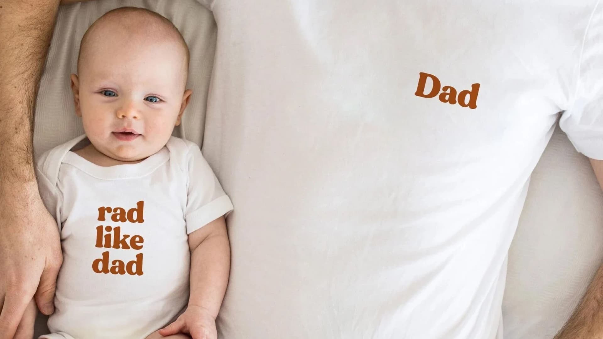 A matching T-shirt saying Dad and a onesie saying Rad Like Dad.