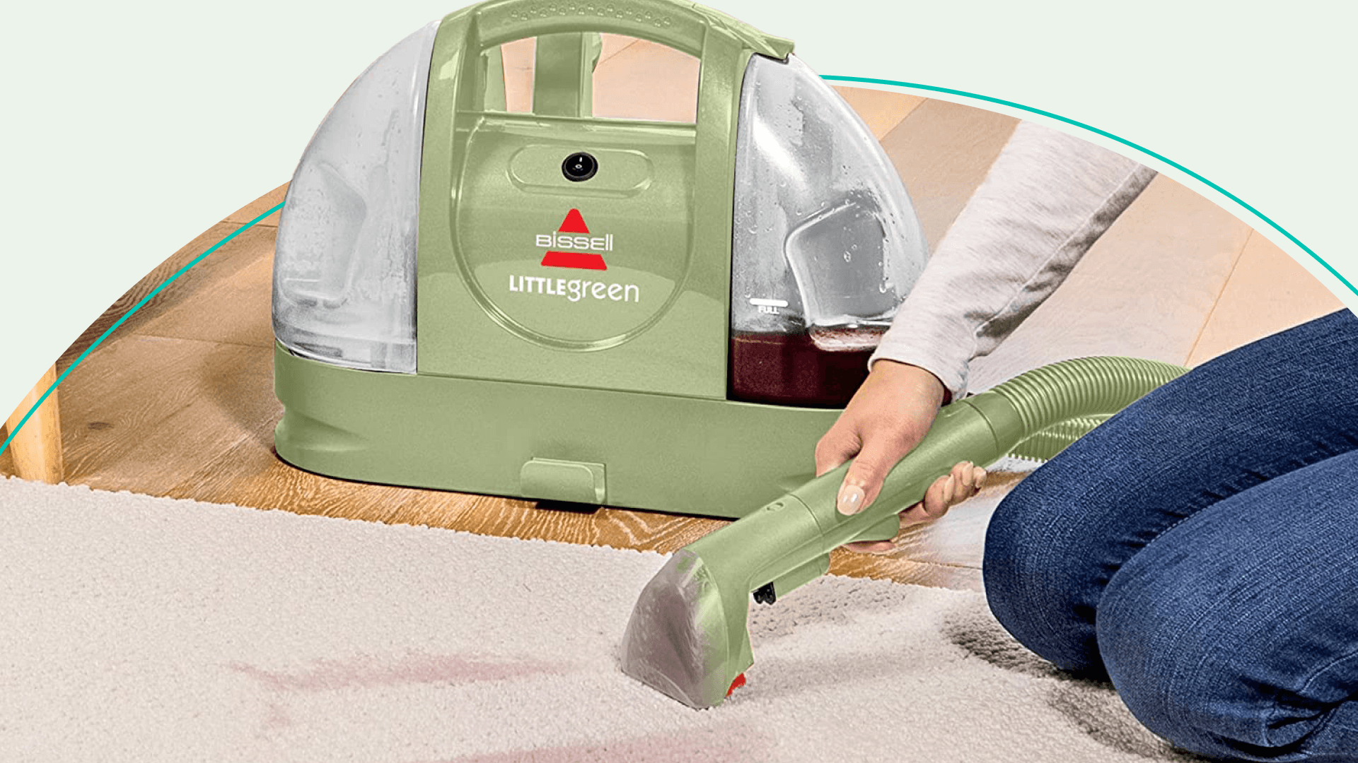 Someone using a Bissell carpet cleaner vacuum to clean a carpet