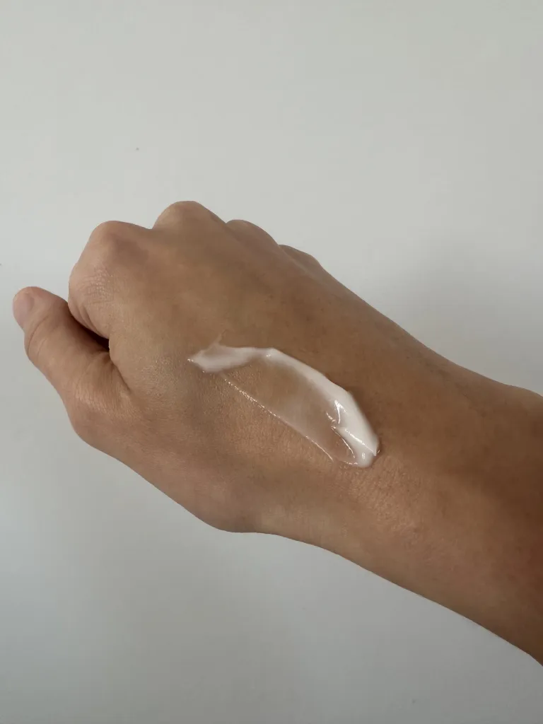 Hand with smear of eye cream