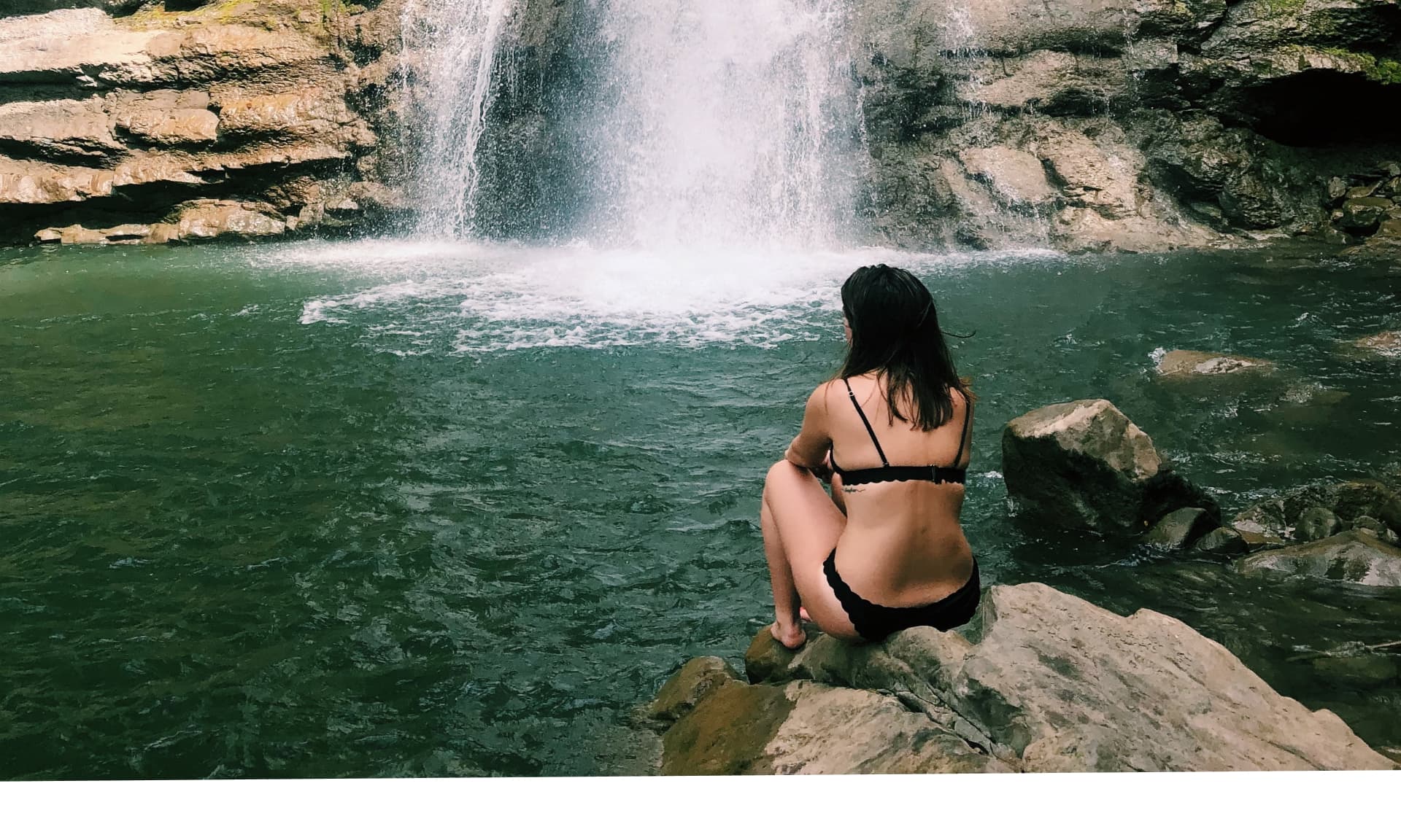 woman near waterfall