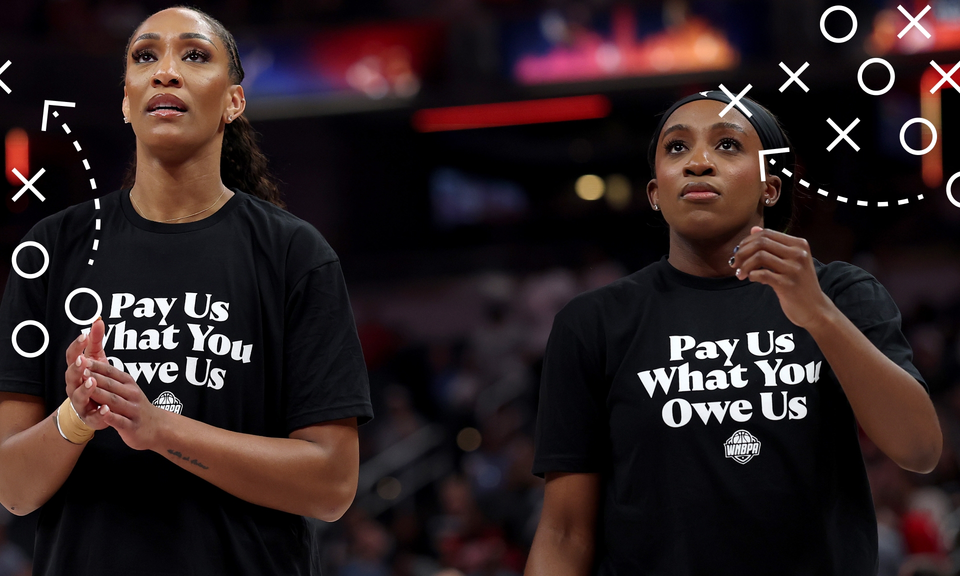 A'ja Wilson and Jackie Young wearing "Pay Us What You Owe Us" shirts at the 2025 WNBA All-Star Weekend