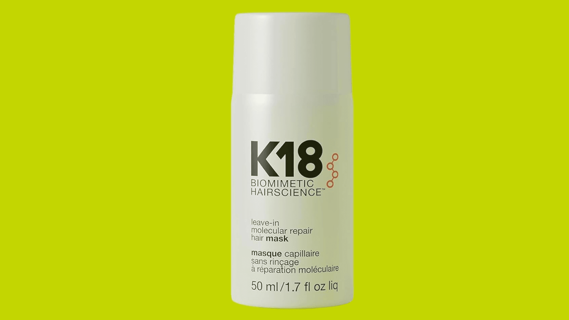 White bottle of K18 on neon green background