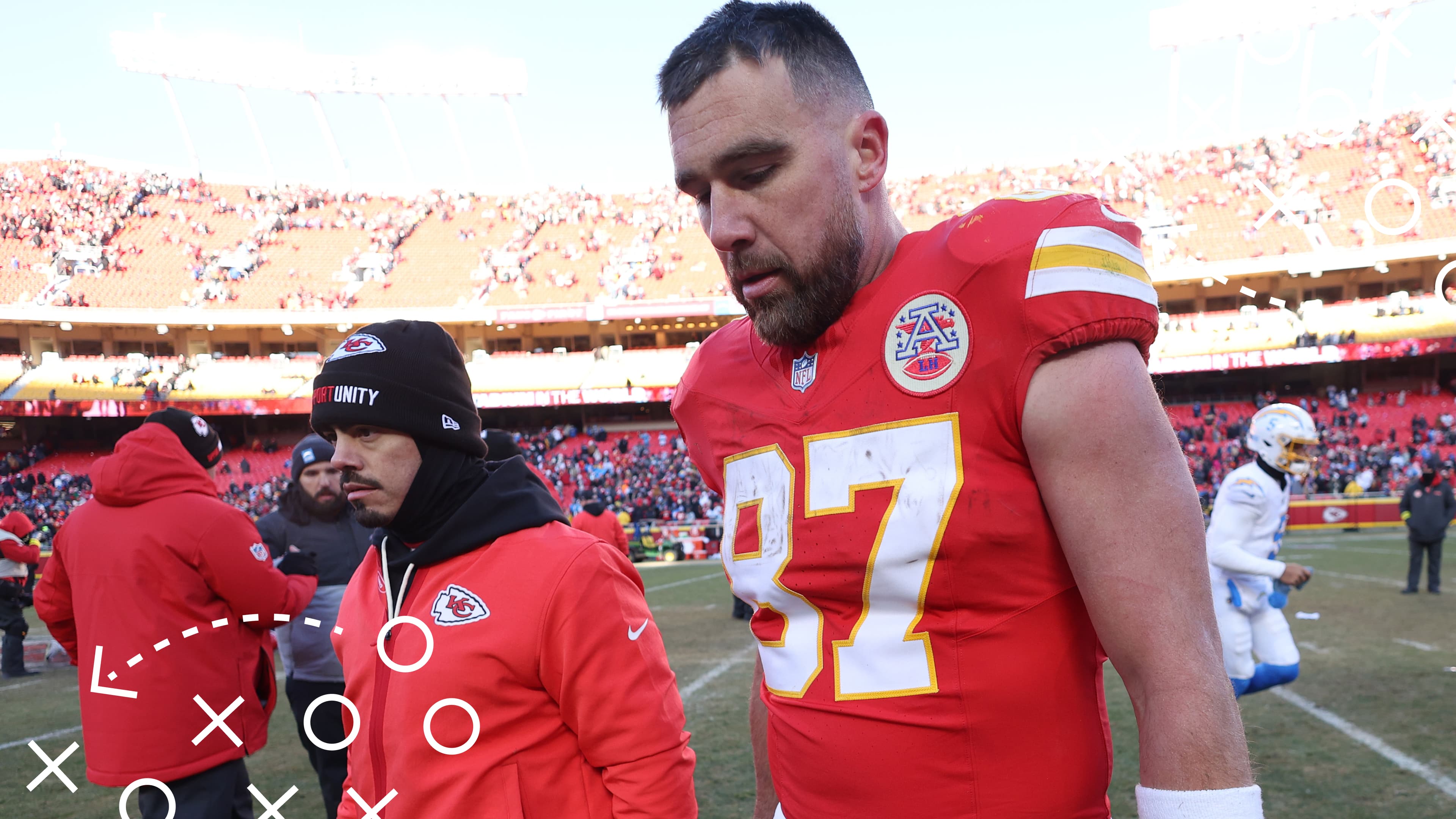 Travis Kelce walks off the field.