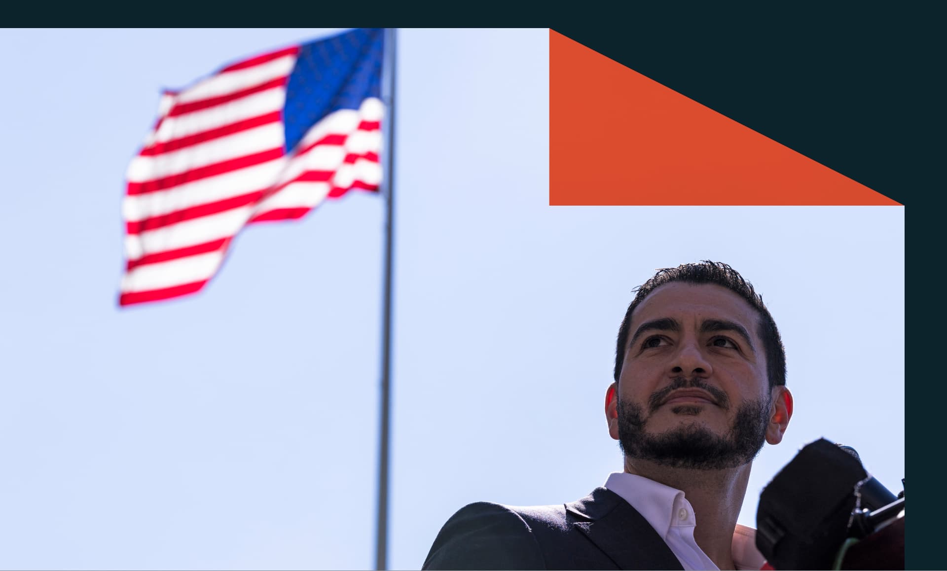 Michigan Democratic Senate primary winner Abdul El-Sayed speaks during a press conference, with an American flag in the background.