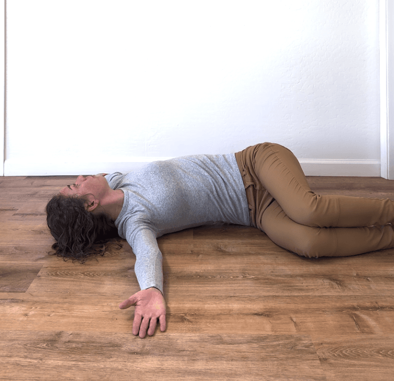 Physical therapist demonstrating open book stretch