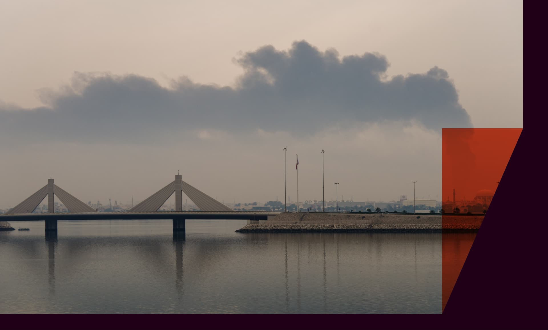 A plume of smoke rises after a reported Iranian strike on fuel tanks in Muharraq