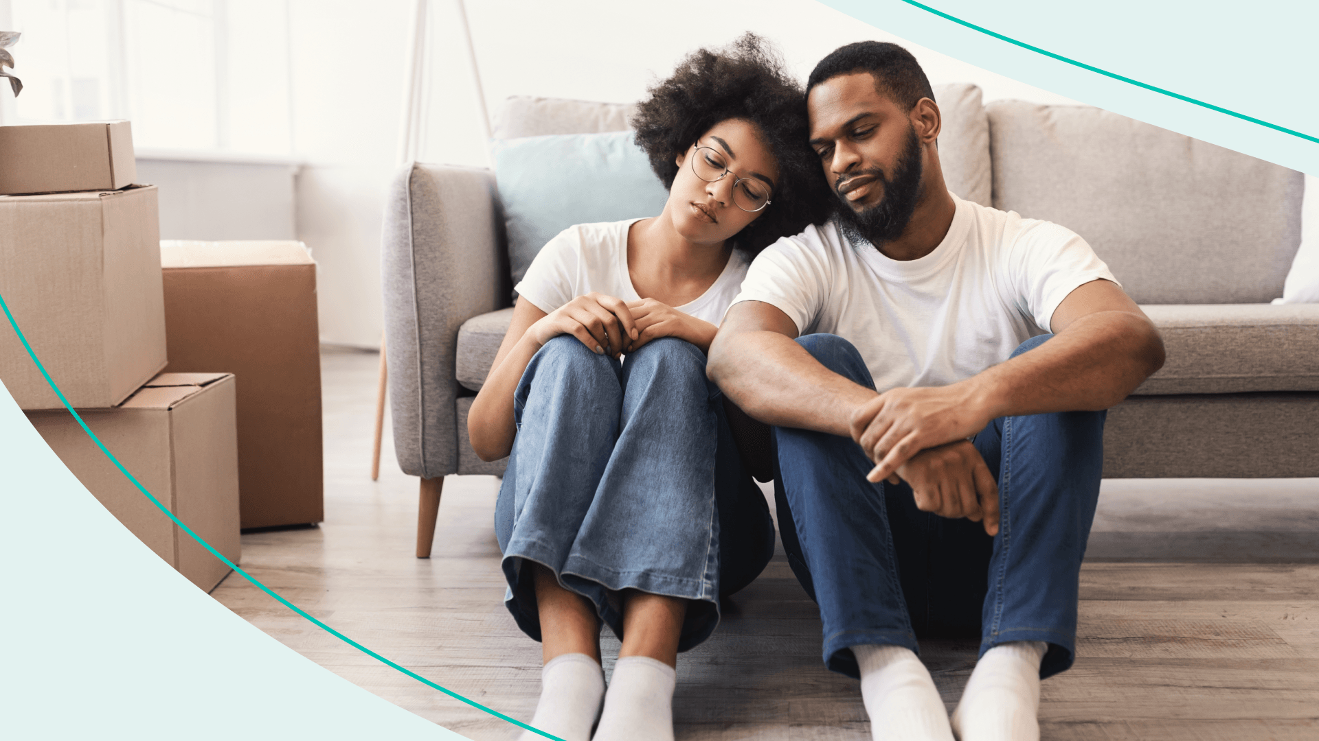 black couple moving boxes