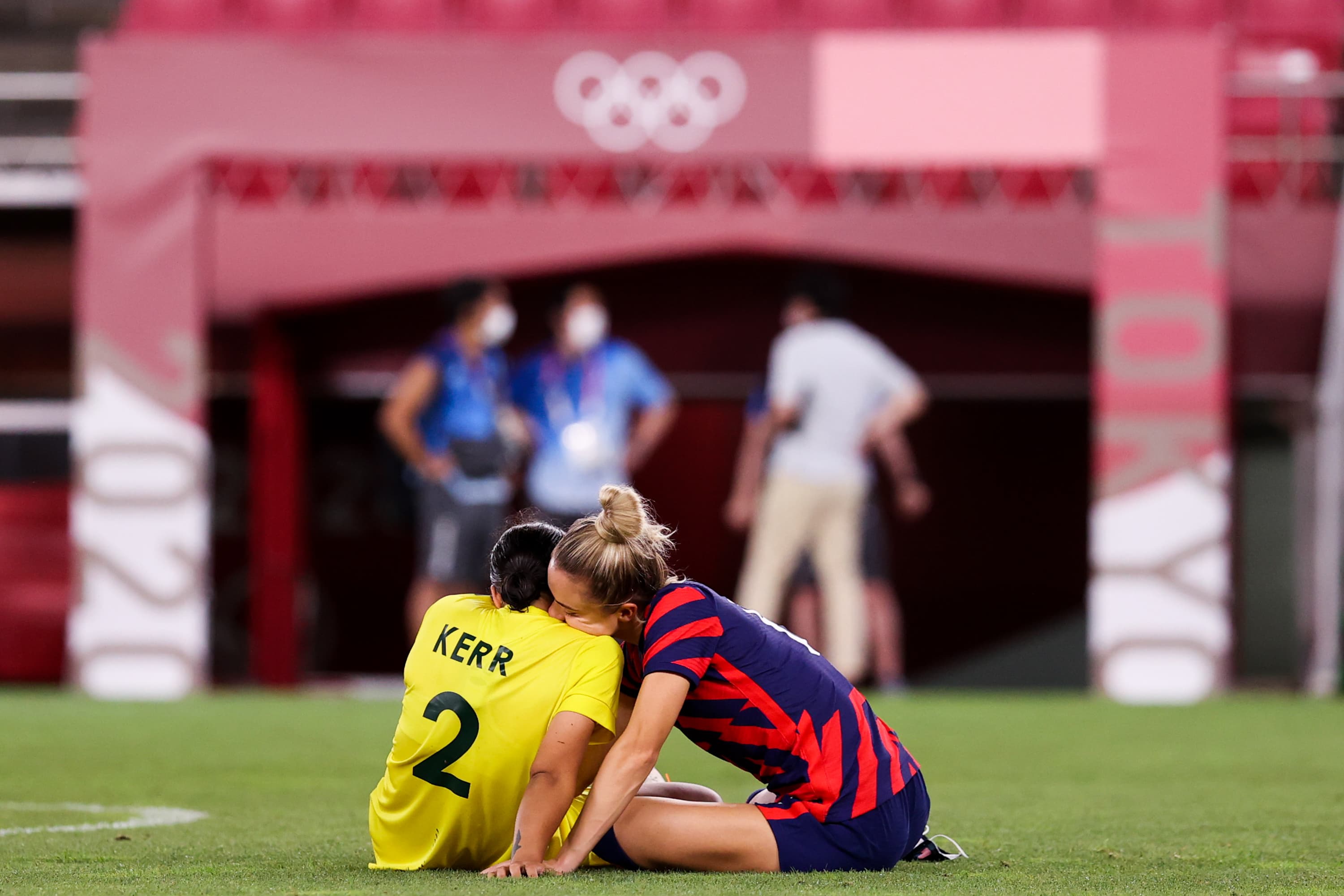 Sam Kerr and Kristie Mewis share a moment after the United States defeated Australia in the 2021 Olympics bronze medal soccer match.