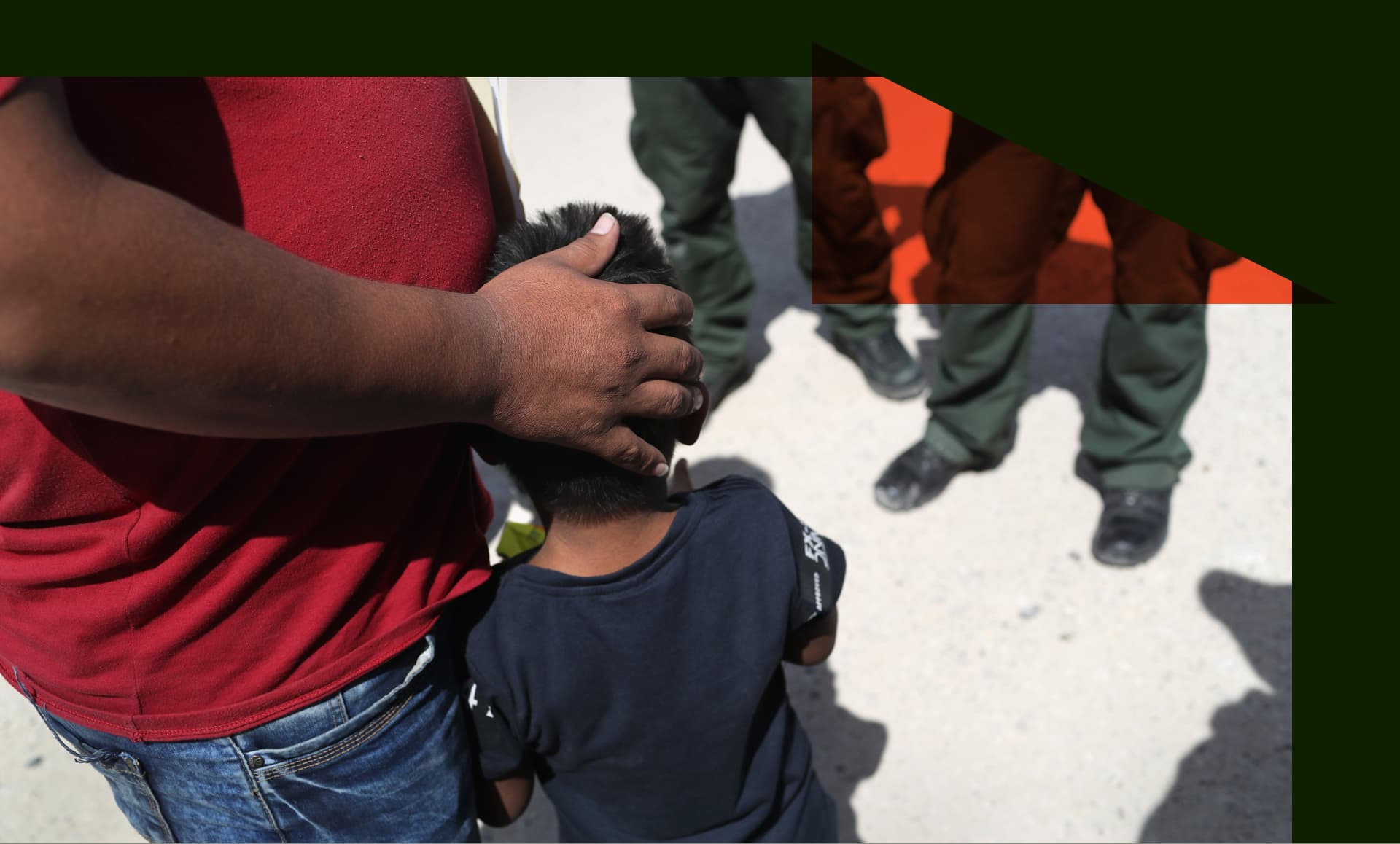 Border Patrol agents take a father and son from Honduras into custody near the U.S.-Mexico border.