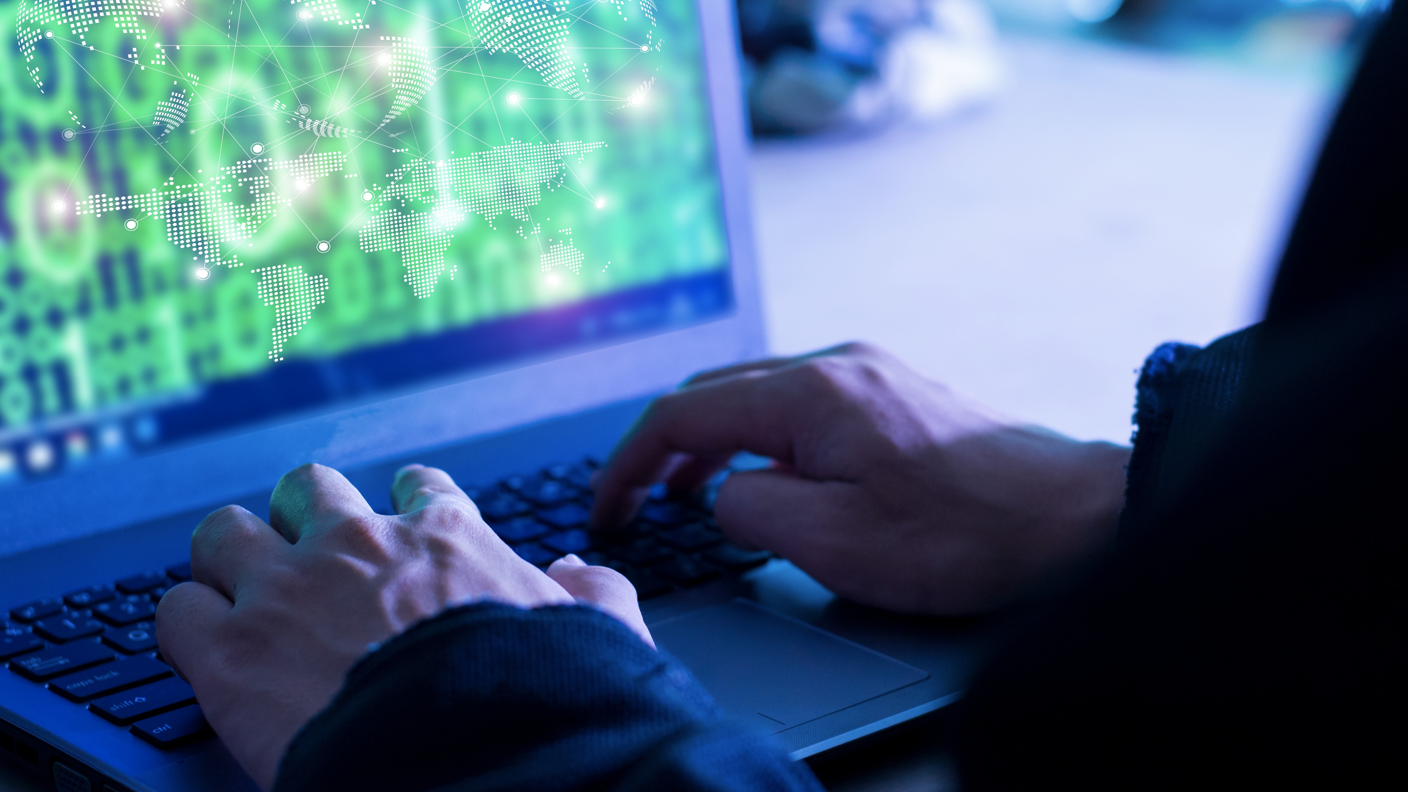 Dangerous Hooded Hacker Breaks into Government Data Servers and Infects Their System with a Virus.