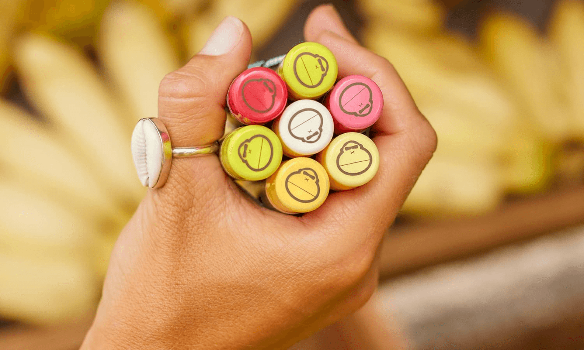 Hand holding assortment of lipbalm