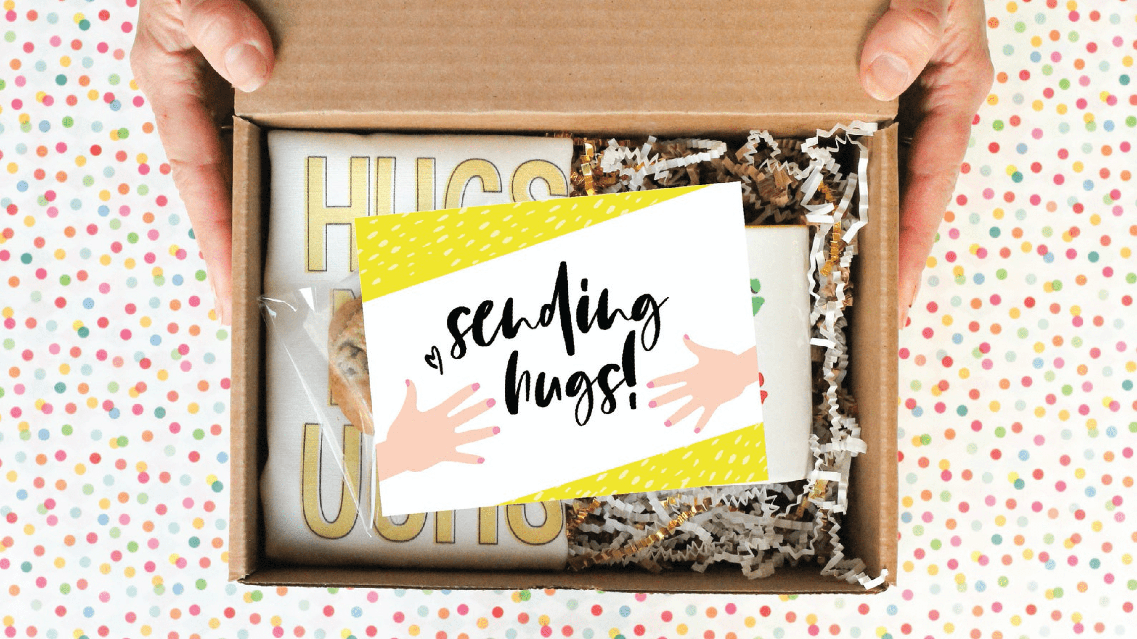 care package with tote, mug, and cookies