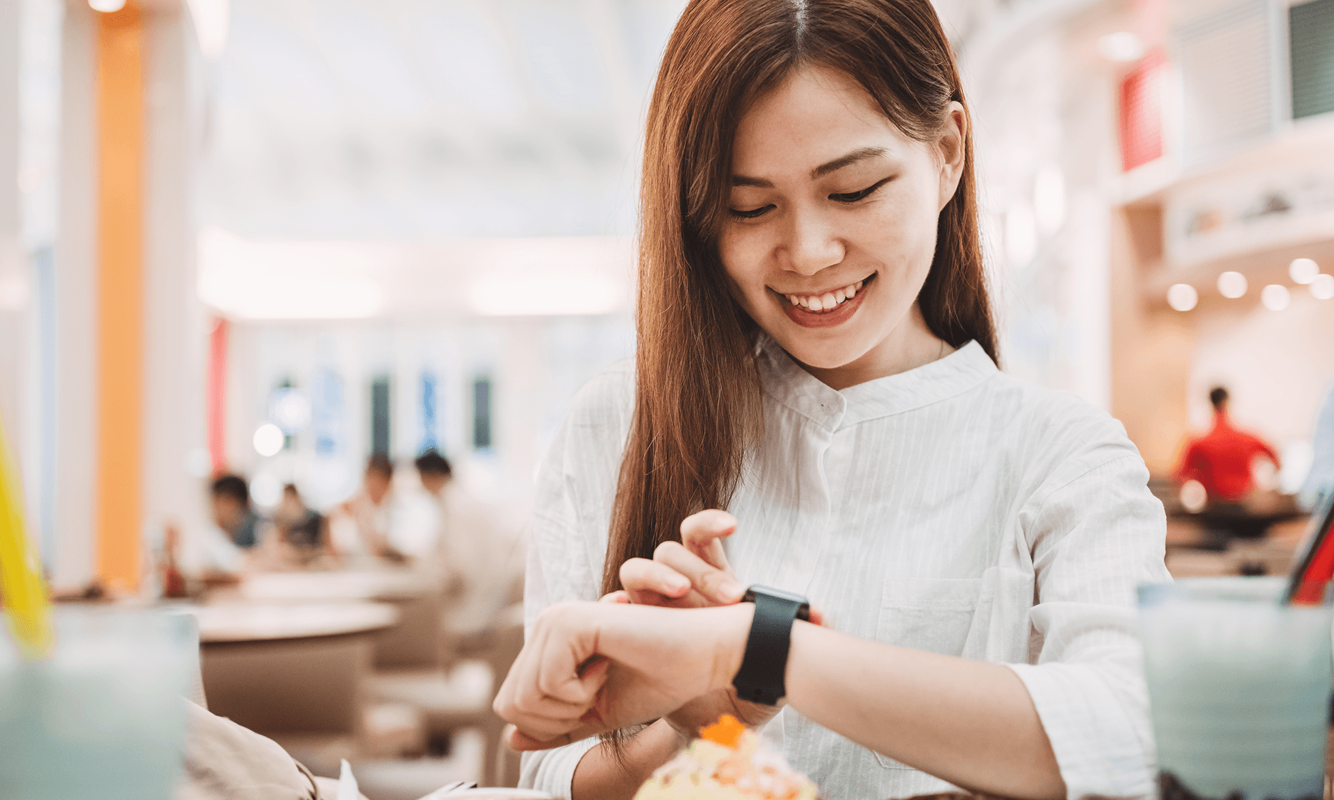 Woman checking Apple Watch