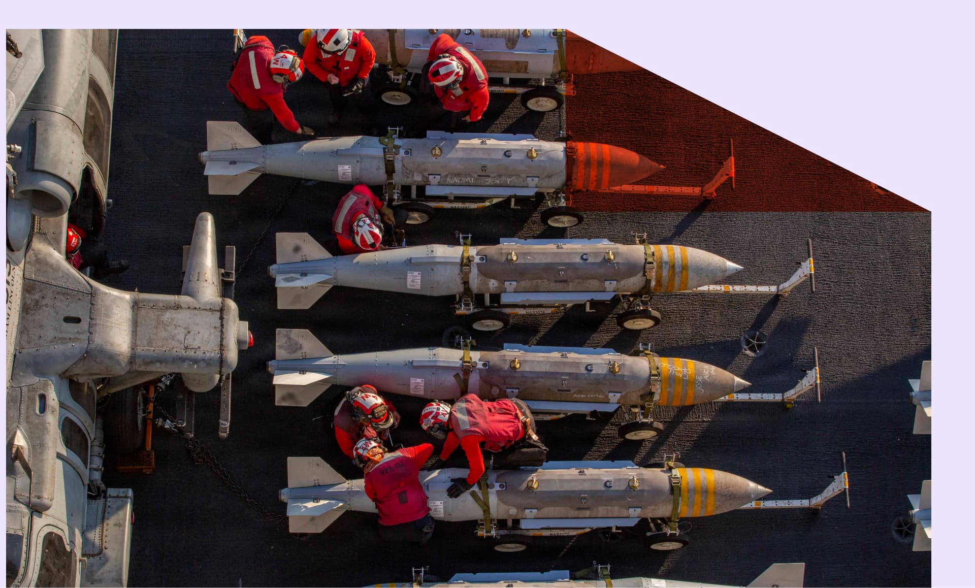 U.S. Sailors prepare to stage ordnance on the flight deck of Nimitz-class aircraft carrier USS Abraham Lincoln (CVN 72) in support of Operation Epic Fury on February 28, 2026 at Sea.