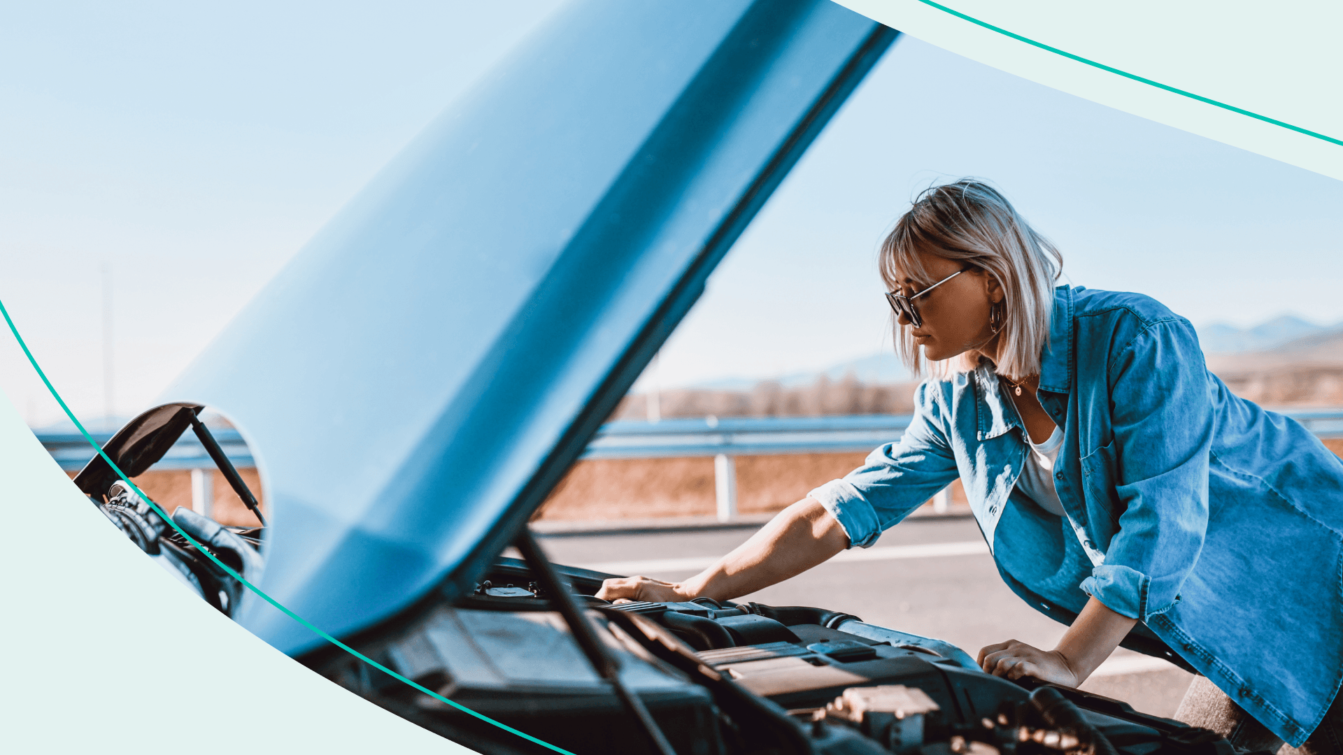 A woman looking under the hood of her broken down car